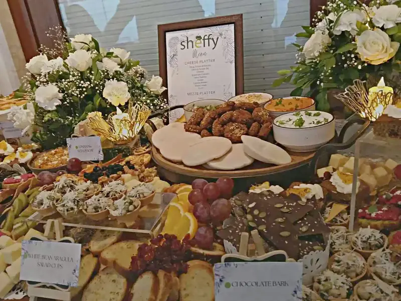 Sheffy-branded cheese platter and grazing table with menu card