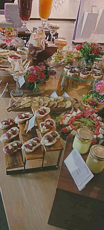 Cocktail evening spread with bruschetta, canapés, and crystal stemware