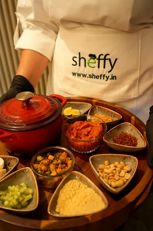 Sheffy team member presenting a tray of condiments and accompaniments